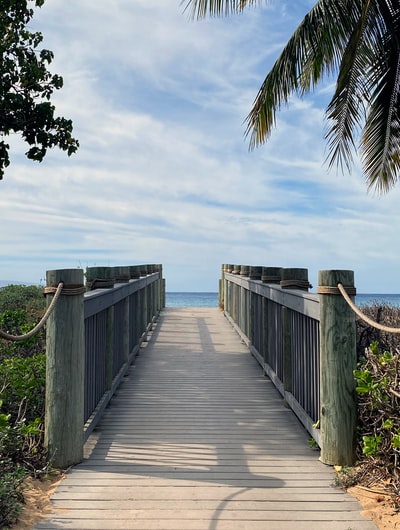 Brown wooden pier under the blue sky during the day
